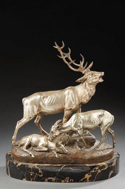 C. Masson Groupe en bronze ciselé, argenté ou patiné représentant un cerf bramant...