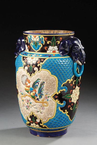J. VIEILLARD & CO Vase decorated in polychrome enamels, supported by elephants.
Size:...