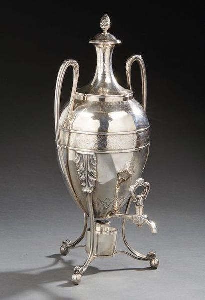 null Large samovar and its ovoid silver lid, resting on three winding feet, the body...