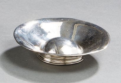 null A plain silver Tastevin, a Bordeaux model with a central umbilicus, resting...