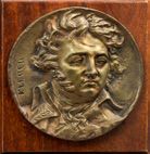 D'après DAVID Paire de médaillons en bronze patiné circulaire représentants Bonaparte...