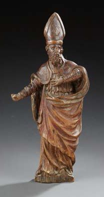 null Statuette en bois sculpté et patiné représentant un évêque.
XVIIe siècle.
H.:...