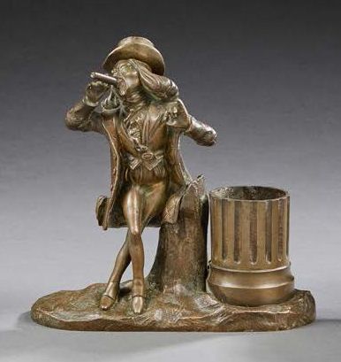 null Pyrogène (?) en bronze présentant un dandy fumeur de cigare à chapeau amovible,...