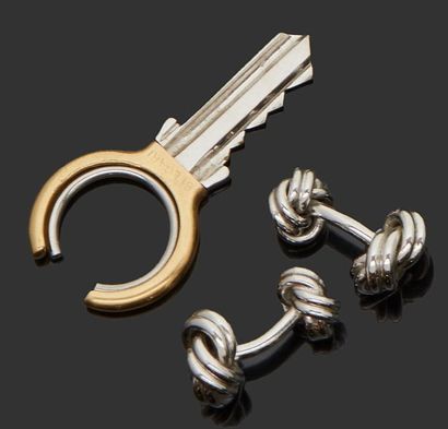 BULGARI 
18K (750) yellow gold key ring forming a key.
Gross weight: 7.89 g
A pair...