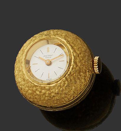 JEAN PERRET 
Montre boule en métal doré, cadran argenté, index bâtons appliqués formant...