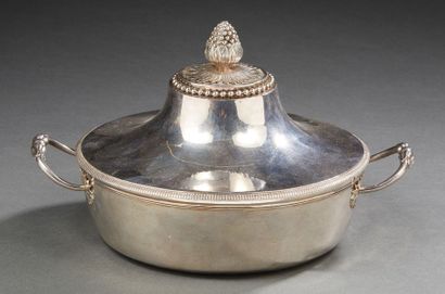null A circular silver covered vegetable dish, the plain body is bordered by a moulding...