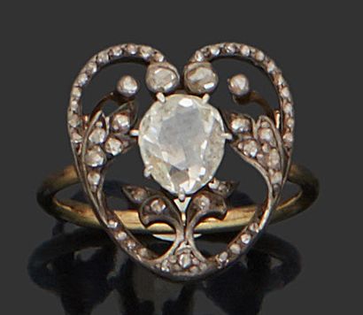 null Ring of openwork heart shape, set with one of an old oval cut diamond. The shoulder...