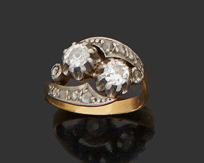 null 18K (750) yellow gold ring you and I set with two diamonds and brilliantly cut...