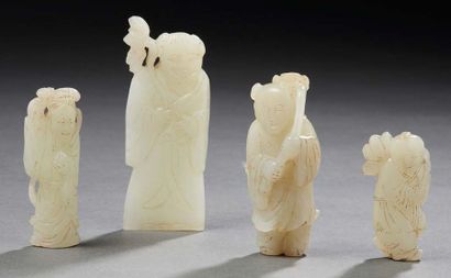 CHINE - XXe siècle Four small celadon nephrite characters, children and immortals...