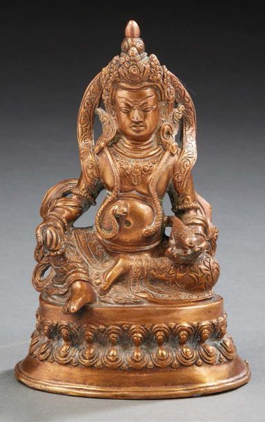 TIBET - XXe siècle Statuette de Jambhala en bronze dépatiné, assis en rajalilasana...