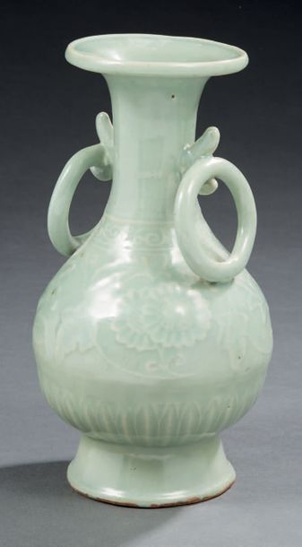 CHINE - XVIIIe siècle Low belly vase in celadon enamelled porcelain with relief decoration...
