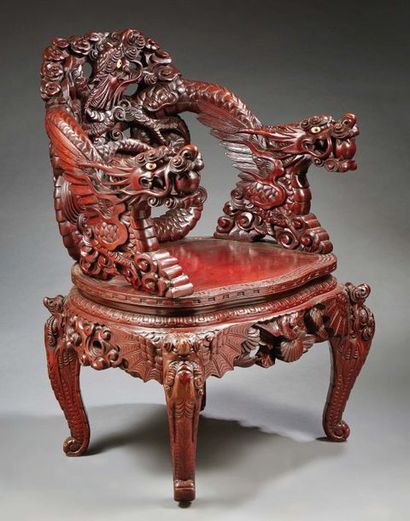 INDOCHINE - Début XXe siècle A wooden armchair, the openwork backrest of a dragon...