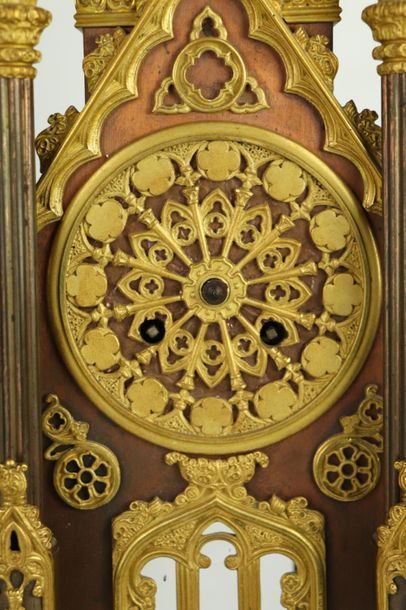 null Cathedral clock in ormolu and patinated bronze.

Rosette dial, richly decorated...