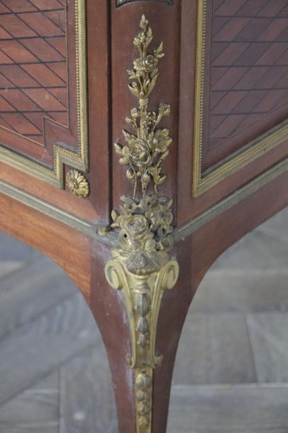 null Showcase in veneer wood marquetry and ormolu ornamentation.

Transition style...