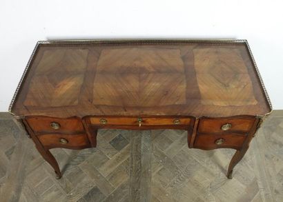 null Veneer marquetry desk opening with four drawers, two rows on each side and one...
