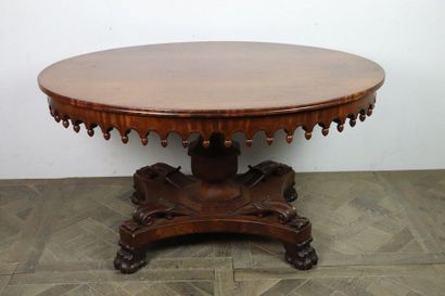 null Middle table in mahogany and mahogany veneer, the belt fretworked and punctuated...