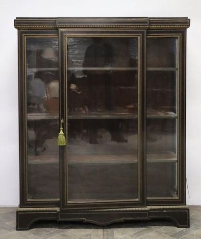 null Three-door showcase in blackened wood, bronze and brass threads.

Napoleon III...