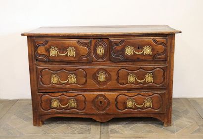 null Moulded and carved natural wood chest of drawers with four drawers on three...