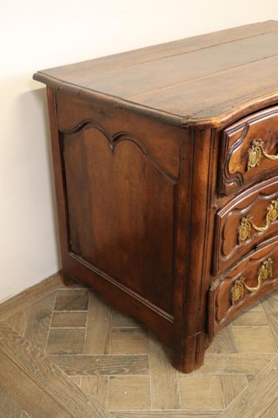 null Moulded and carved natural wood chest of drawers with four drawers on three...