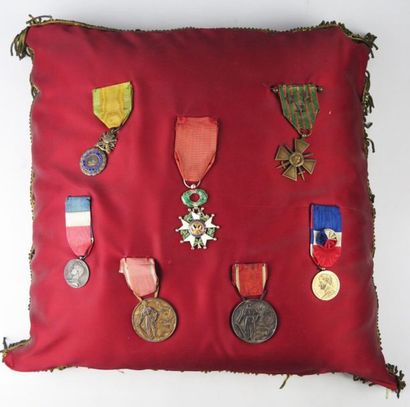 null Cushion with bronze canetilles quilted with seven decorations, including a medal...