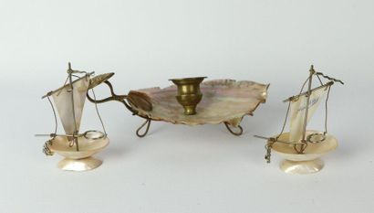 null Two miniature boats in mother-of-pearl and gilded metal and a hand candlestick...