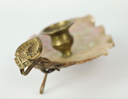 null Two miniature boats in mother-of-pearl and gilded metal and a hand candlestick...