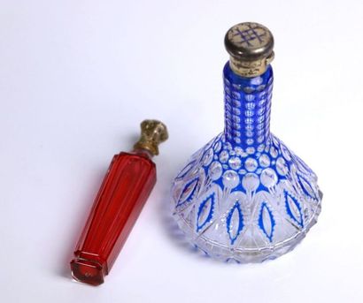 Two colored crystal salt and perfume bottles.

The...