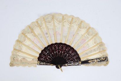 null Blackened or bakelite(?) wood fan with golden and silvery scrolls decoration....