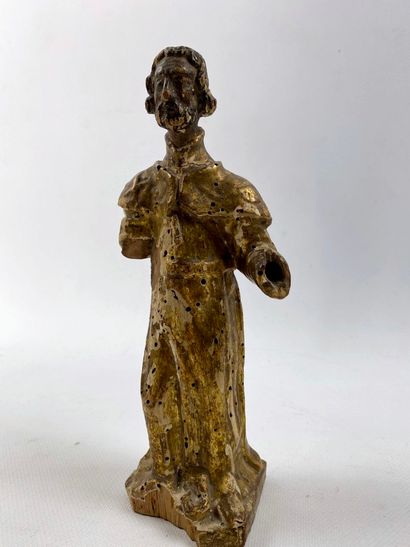 null Statuette figurant un saint, debout, en bois sculpté et doré. 

Epoque XVIIIème...