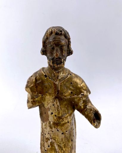 null Statuette figurant un saint, debout, en bois sculpté et doré. 

Epoque XVIIIème...