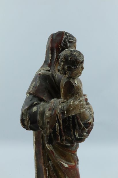 null Vierge à l'enfant.

Sculpture en bois sculpté, doré et polychrome.

XVIIIème...