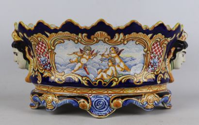 null NEVERS, Antoine Montagnon.

Jardinière en faïence à décor polychrome d'amours...