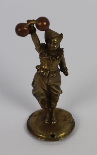 null Statuette en bronze et cuivre représentant un jongleur avec une haltère. 

H_10,5...