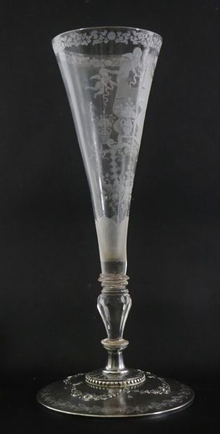 null A glass truncated cone bowl on a foot, engraved with a monogram surmounted by...