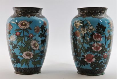 null JAPAN. 

A pair of cloisonné vases decorated with flowers and butterflies on...