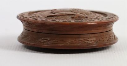 null Circular box in exotic walnut carved on one side with a portrait of Louis XVIII...