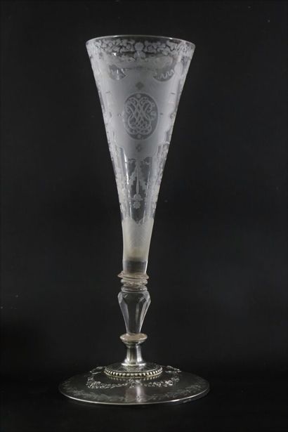 null A glass truncated cone bowl on a foot, engraved with a monogram surmounted by...