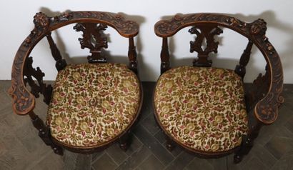 null Pair of armchairs in natural wood. 

The rounded backrest is decorated with...