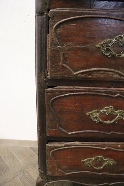 null Moulded and carved oak chest of drawers opening to three drawers on three rows....