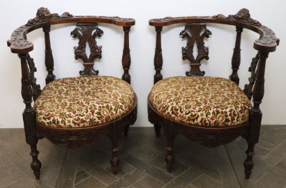 null Pair of armchairs in natural wood. 

The rounded backrest is decorated with...
