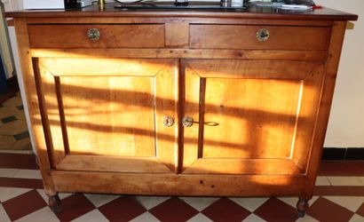 null Walnut and cherry wood sideboard with two doors and two drawers.

First half...