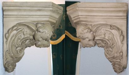 null Pair of large wall brackets in grey patinated plaster, decorated with two angel...