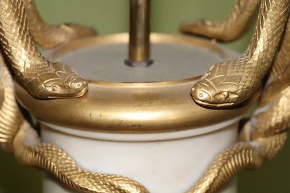 null Important vase in white marble and gilt bronze, the handles formed of snakes.

After...