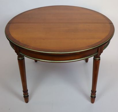 null 
Circular table and suite of four chairs in cherry wood, underlined by a line...
