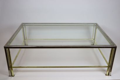 null French work from the 1980s.

Coffee table in silver and gilded metal and glass...
