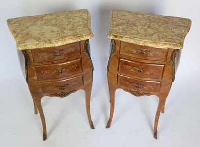 null Pair of bedside tables in rosewood veneer, marble tops, opening with three drawers....