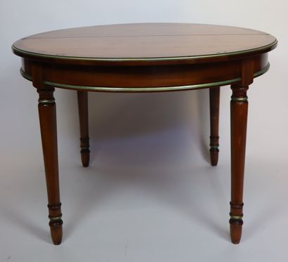null 
Circular table and suite of four chairs in cherry wood, underlined by a line...