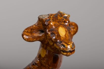 null Pair of lying deer in brown and yellow glazed clay.

H_19 cm W_19 cm and H_17...