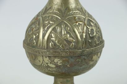 null NEAR EAST and NORTH AFRICA.

Set of brassware including :

two iron vases with...