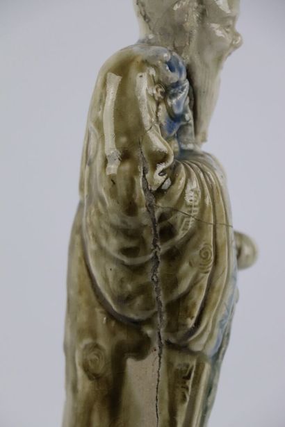 null CHINA.

Enamelled stoneware statuette representing Shou-Lao holding the peach...